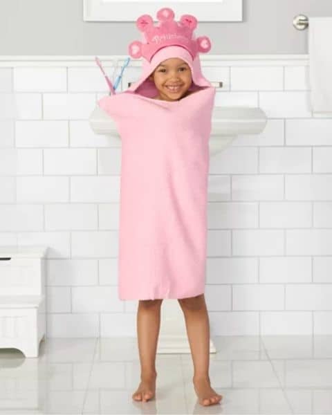 child wearing a princess hooded towel