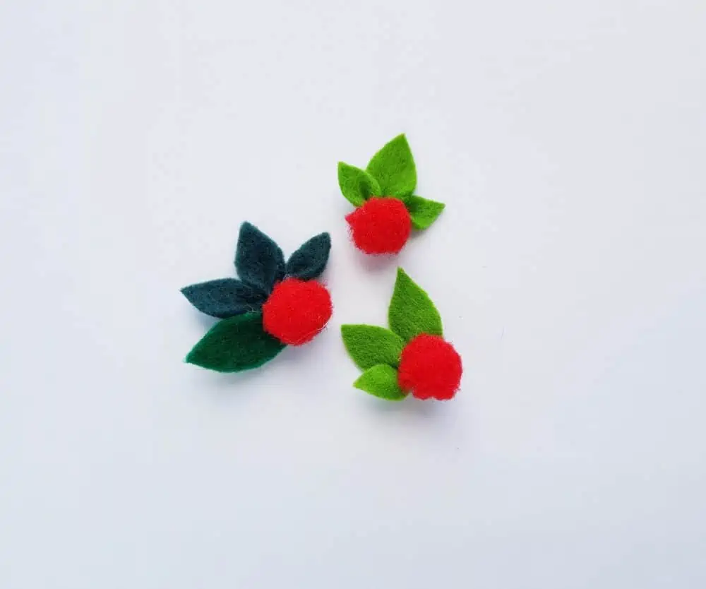 Add pompom\'s to felt leaves for DIY Nativity Christmas craft.