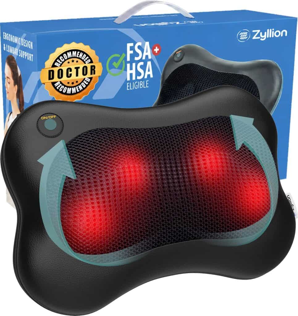 Black Zyllion massage pillow with glowing red nodes and power button, placed in front of its blue box.