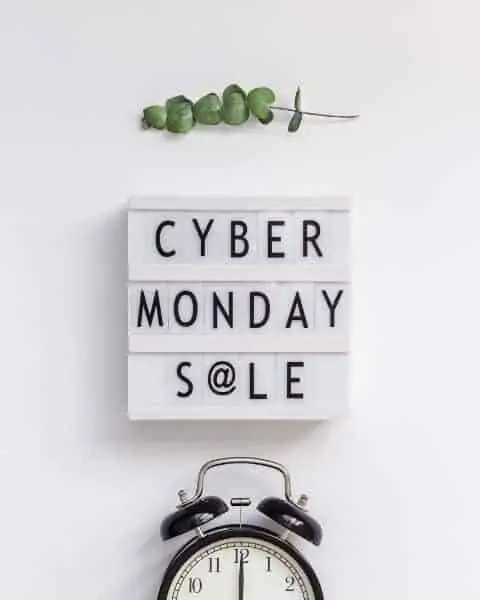 Cyber Monday Sale sign and an alarm clock