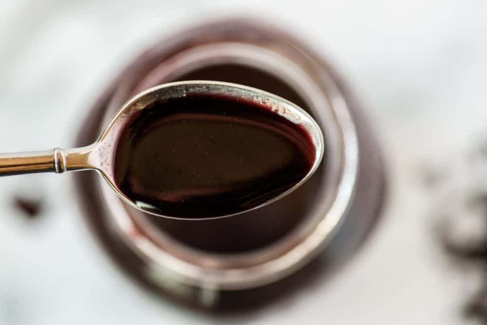 A close up of a cup, with Elderberry
