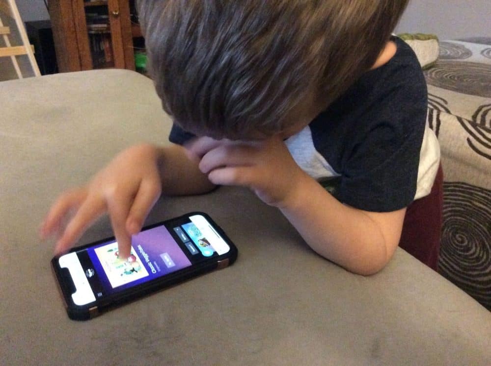 A young boy watching shows from Yippee family streaming.