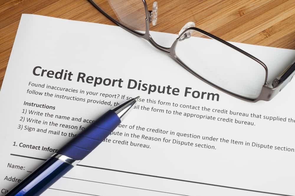 Credit report dispute score on a desk