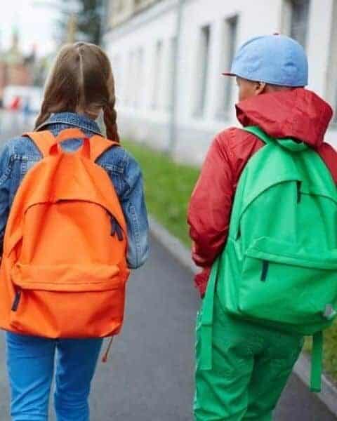 boy and girl with backpacks