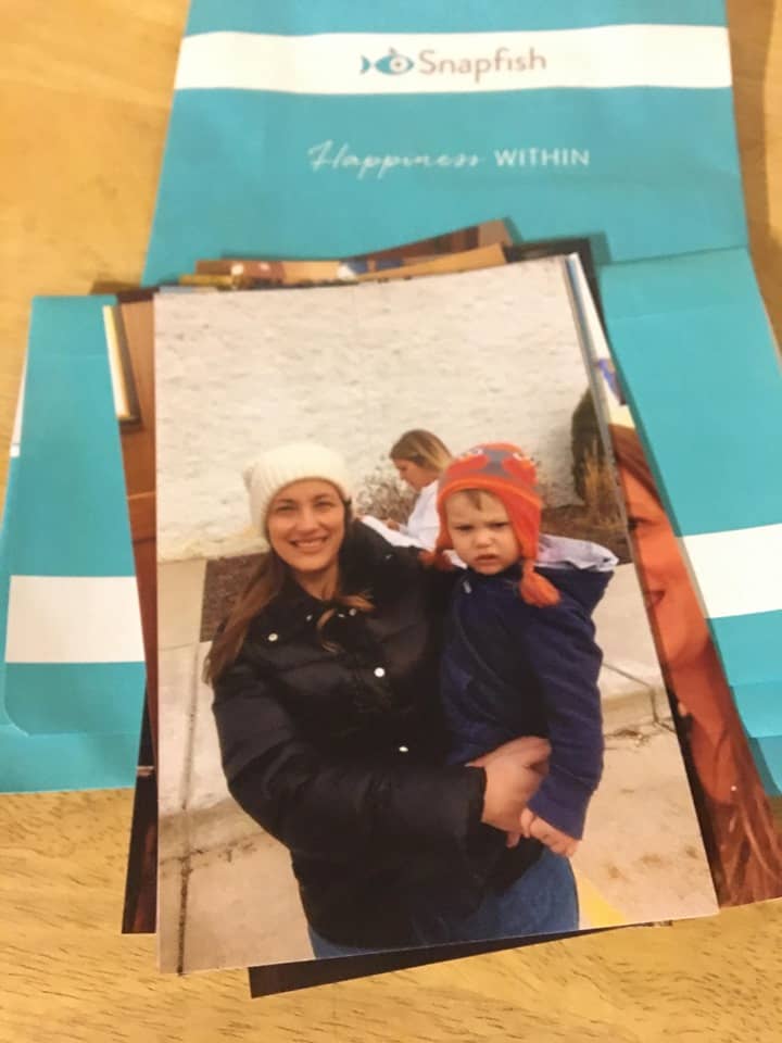 A stack of pictures, including a woman and child, from using a Snapfish free coupon code.