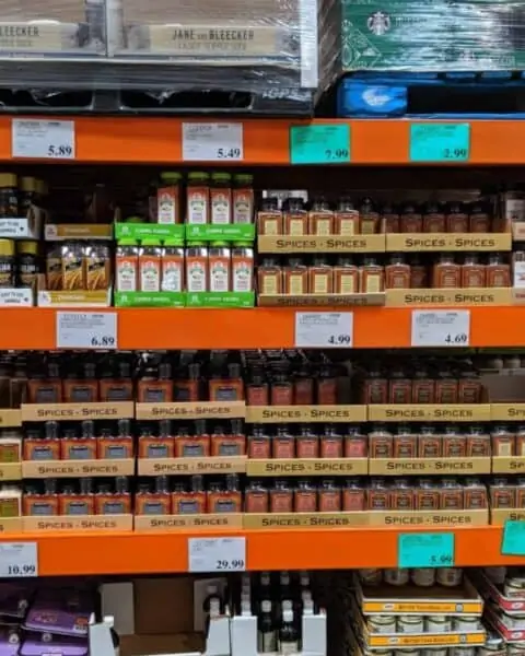 Spice rack and containers on the shelves of Costco.