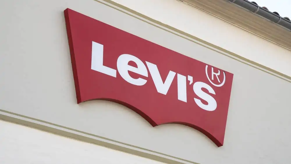 A Levi\'s sign on their storefront. For quick and easy Levi\'s coupons.