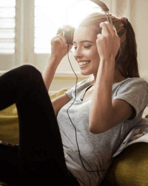 woman listening to music on headphones
