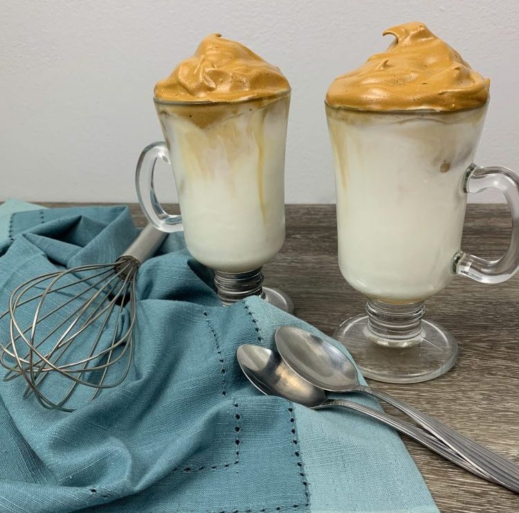whipped coffee drinks sitting on a table