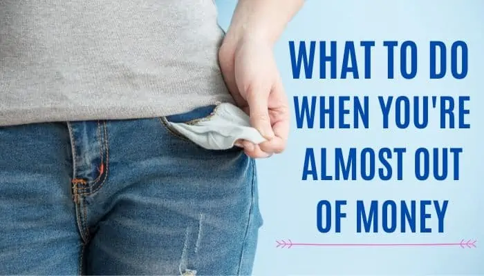 A woman showing her empty pockets. What to do when money is gone?