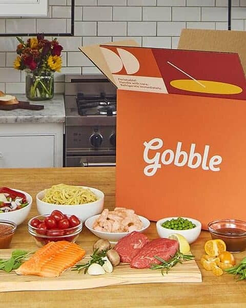 A plate of food on a table from Gobble with their meal planning services.