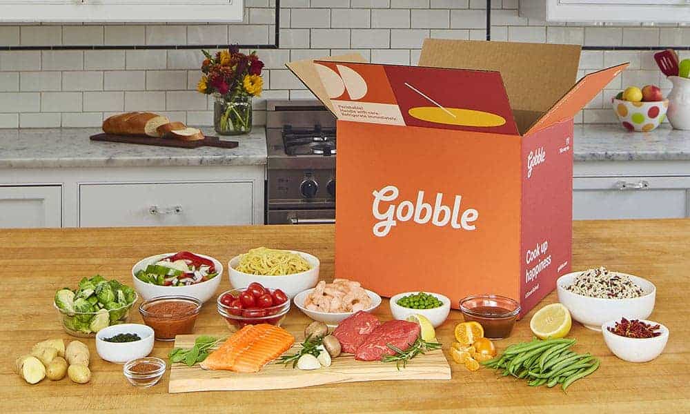 A plate of food on a table from Gobble with their meal planning services.