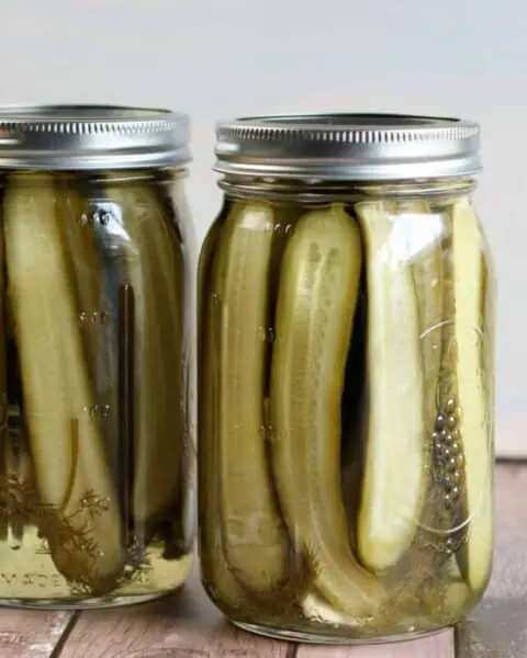 Mason jar full of homemade dill pickles.