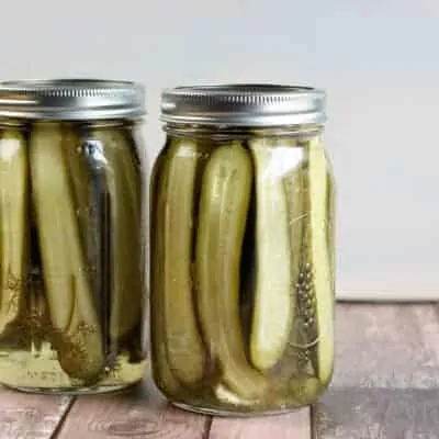 Mason jar full of homemade dill pickles.