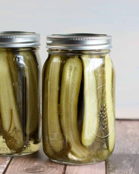 Mason jar full of homemade dill pickles.