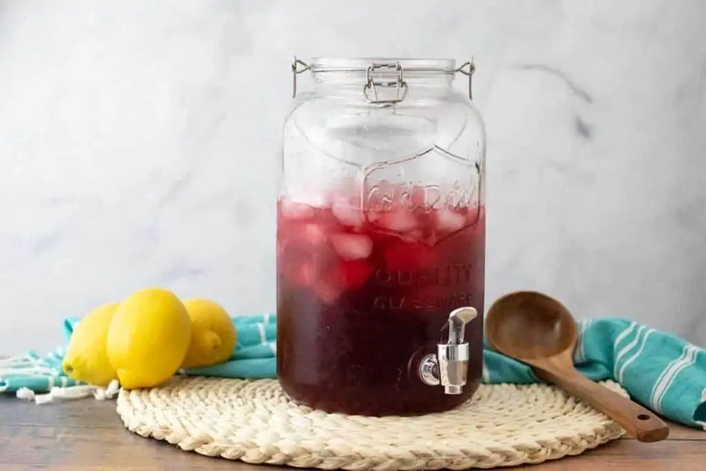 hibiscus iced tea in a large mason jar pitcher
