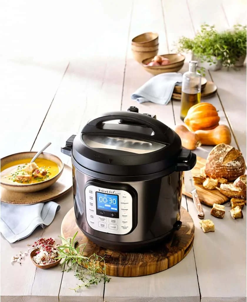 An Instant Pot and tray of food on a table