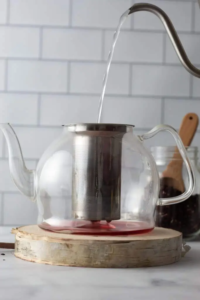 making hibiscus rosehip tea
