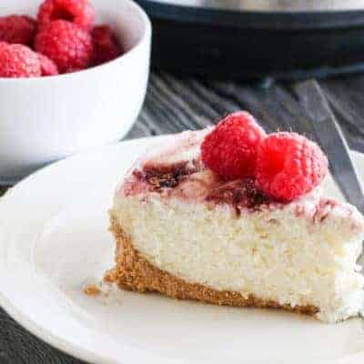 A slice of raspberry cheesecake recipe made from an instant pot.