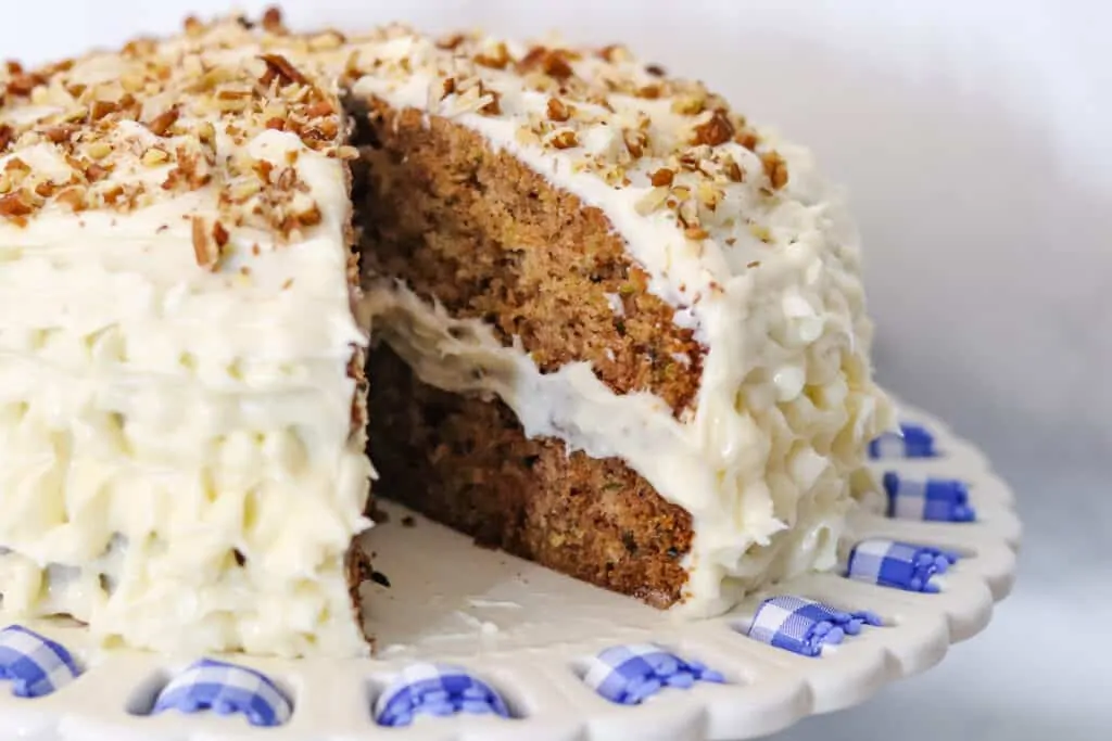 Zucchini cake with a slice of cake removed. 