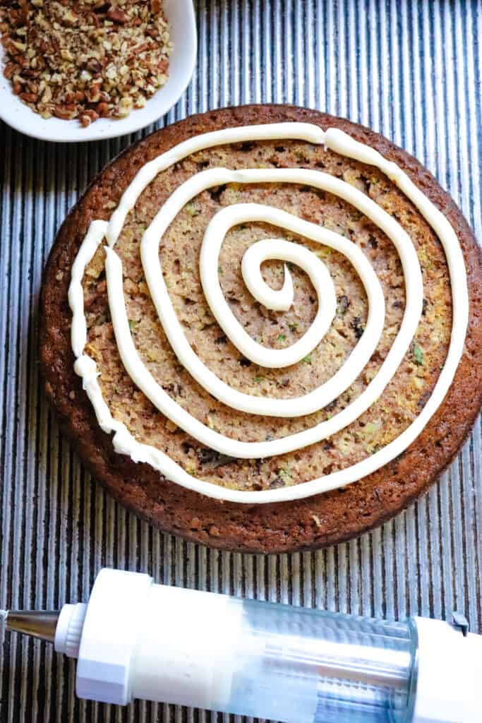 Zucchini Cake with a swirl of homemade frosting.