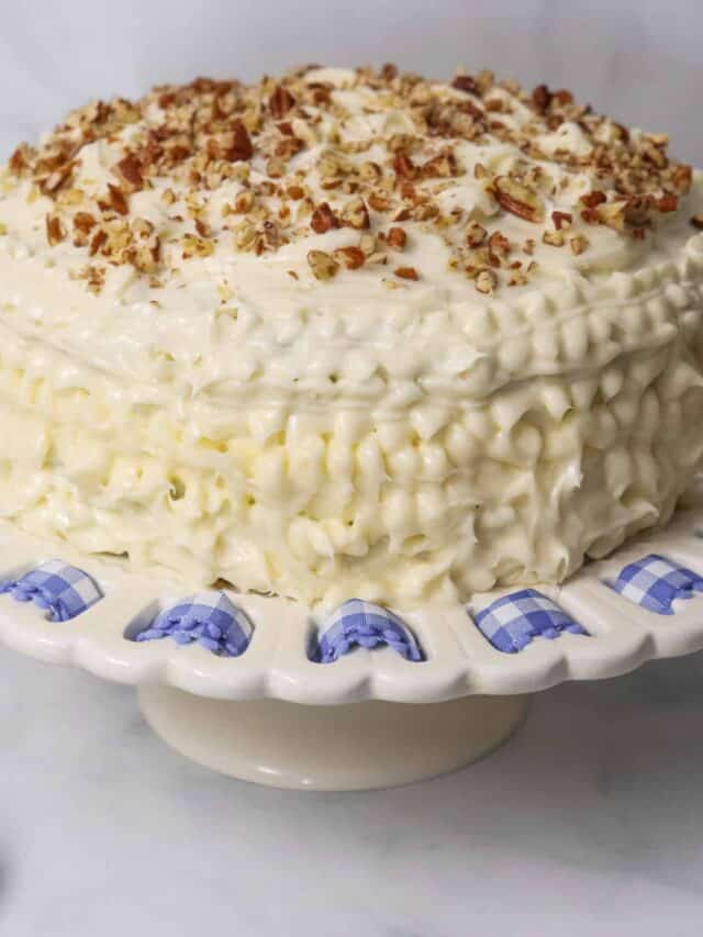 A big zucchini cake with garnishing on top.