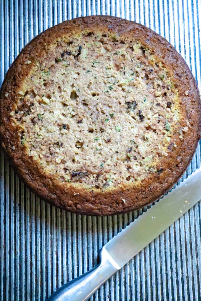a round zucchini cake with the top cut off.