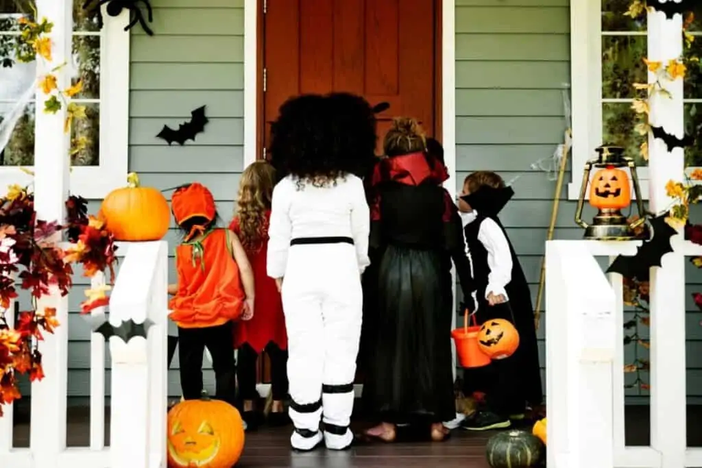 A group of children going trick-or-treating as a group.