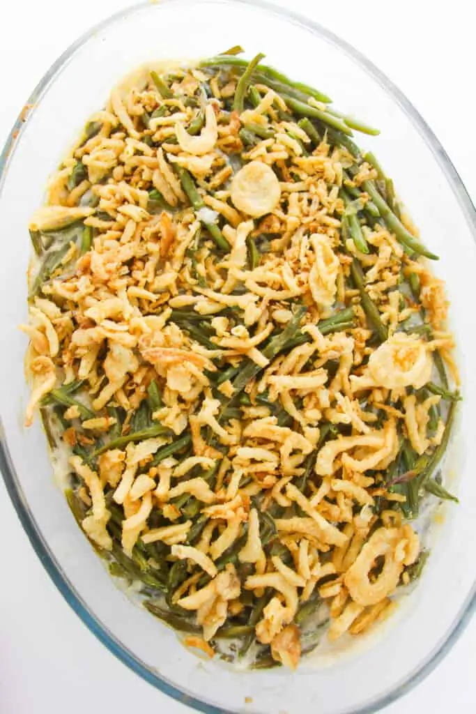 a casserole dish with green beans topped with french fried onions 