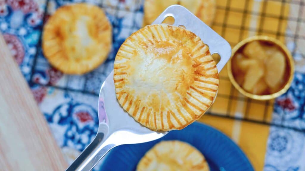 A close up of a mini apple pie 