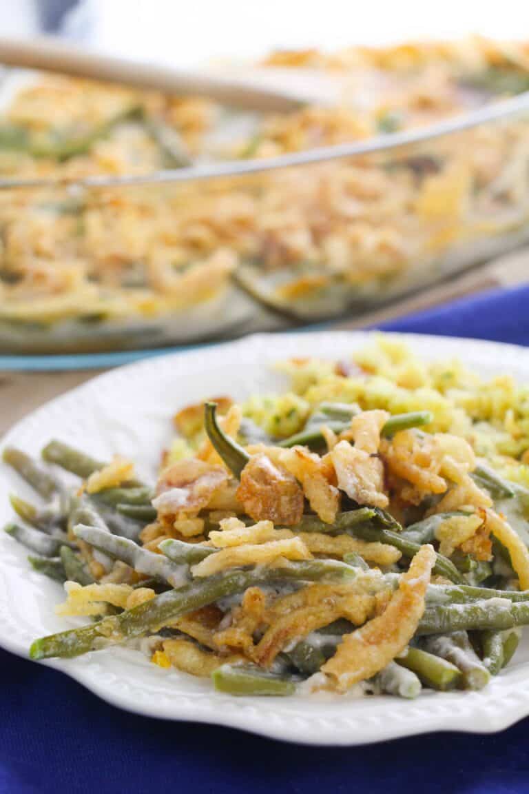Homemade green bean casserole from scratch on a white plate.