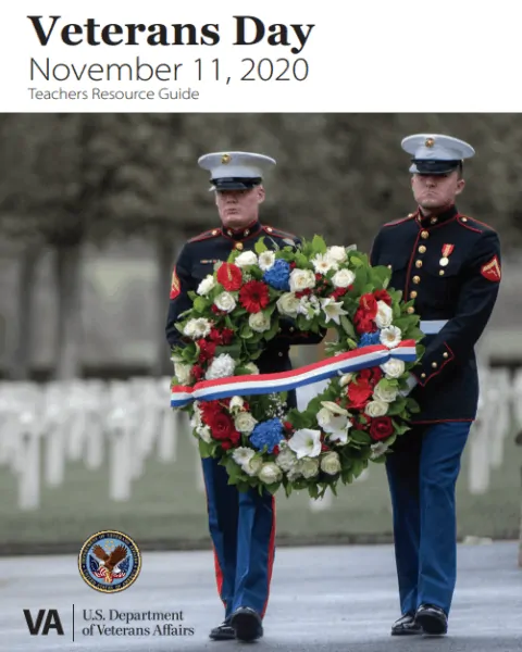 Two marine corp soldiers carrying wreath for Veterans Day on November 11th.