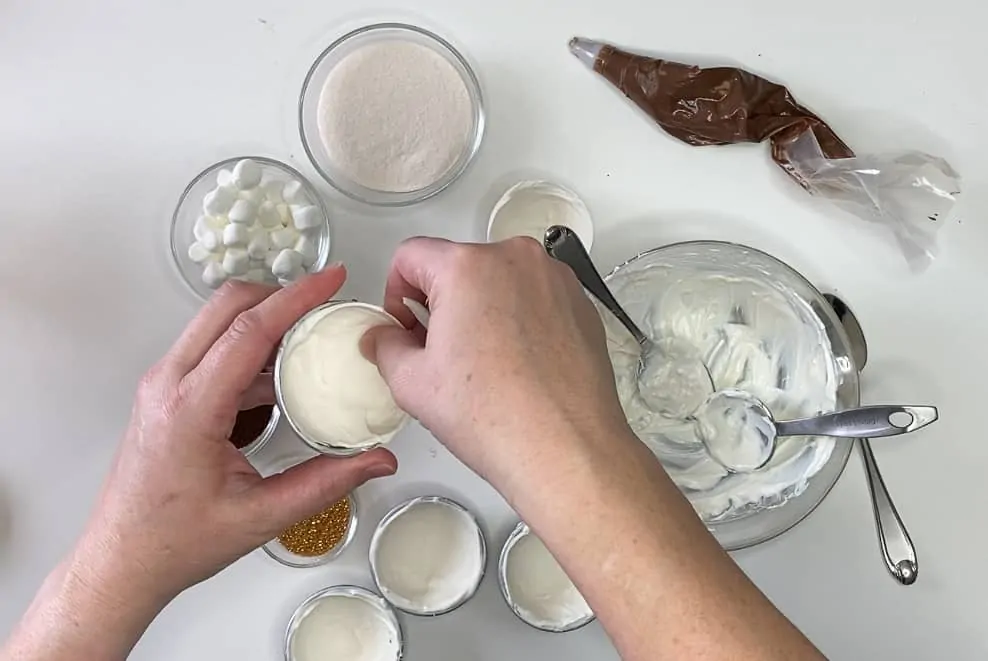 Stir ingredients together and gently tap sides of the mold to make white chocolate cocoa balls.