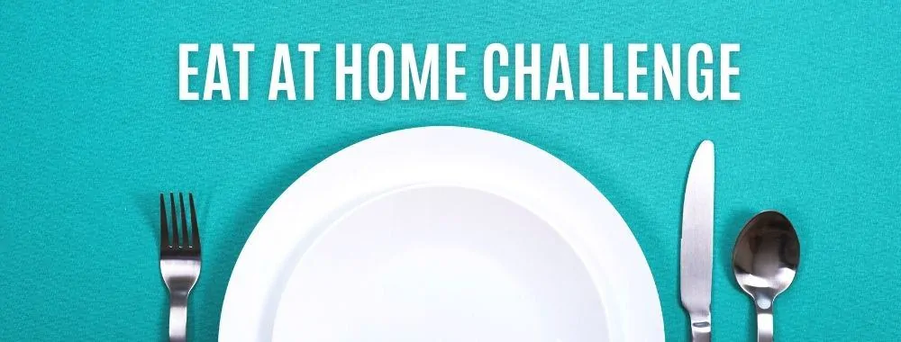 Empty white plate with fork, knife, and spoon for an eat at home challenge.