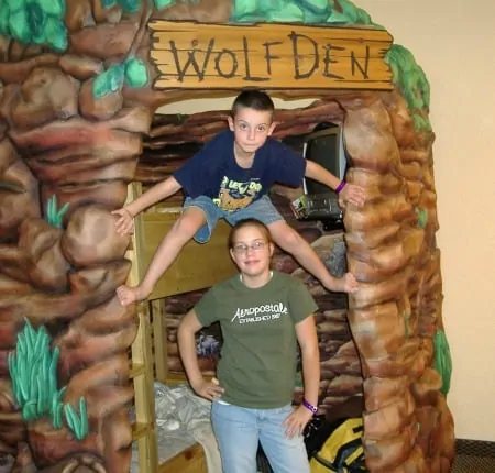 Wolf den play area with kids standing outside.