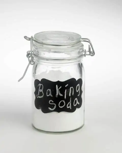 A glass container of baking soda.