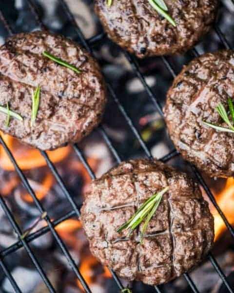 Grilled hamburger patties on a bbq.