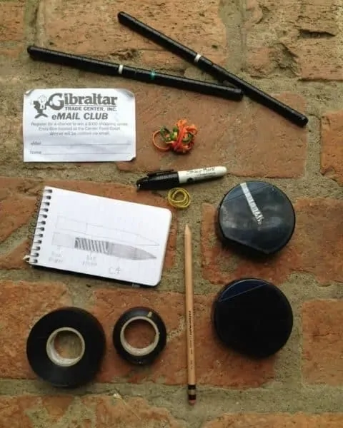 A variety of items, including electrical tape and a permanent marker.