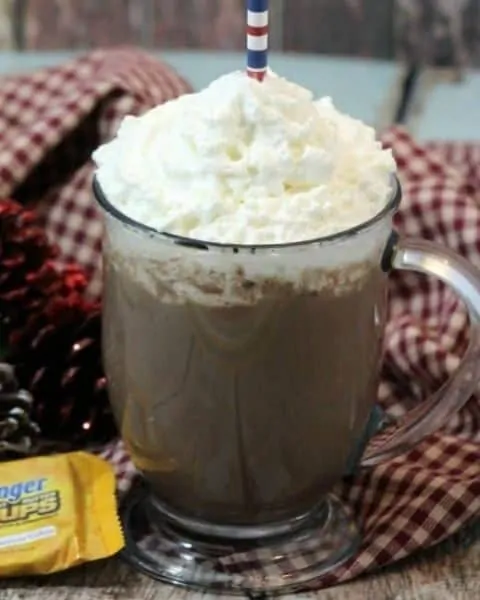 Clear glass cup of candy bar hot chocolate.