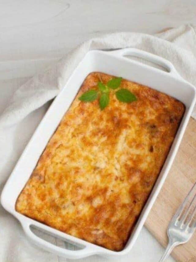 Homemade breakfast casserole in a white casserole dish.