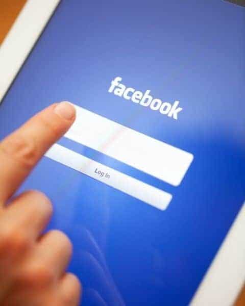 A tablet open to Facebook with a person trying to log in.