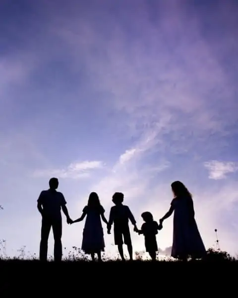 A silhouette of a family with small children.