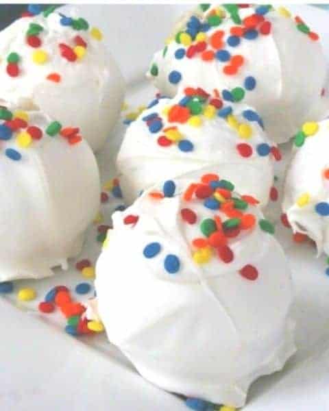 A small group of funfetti cookie dough bites of a sweet treat.