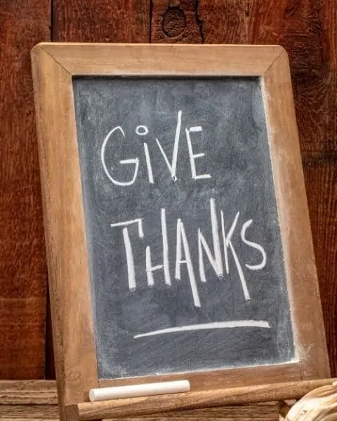 A sign that reads "Give Thanks".