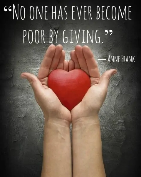 A child's hands holding a red heart with a quote by Anne Frank.