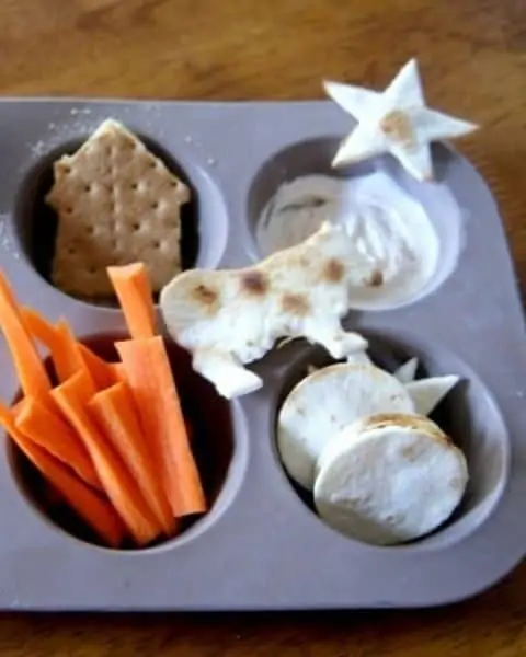 Good Night Moon themed lunch, including a cow shaped tortilla, carrots, stars, and more.