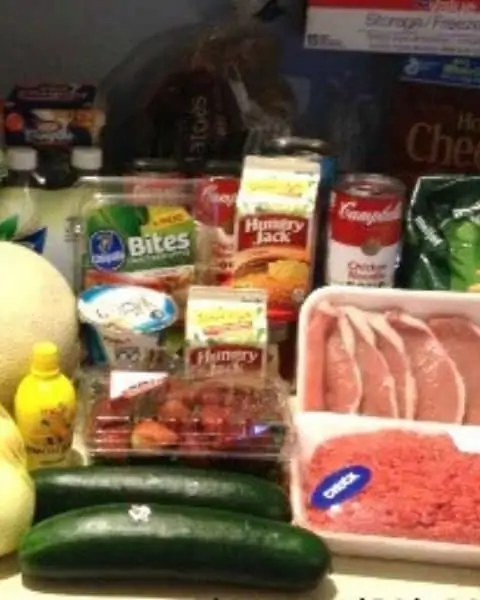 Grocery haul including meats, cucumbers, strawberries, and more.
