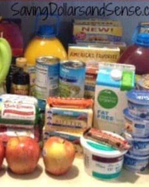 A variety of groceries from produce, juice, milk, yogurt, and more on the kitchen counter.