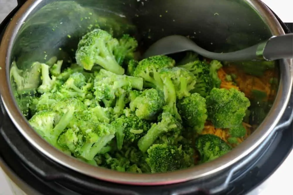 close up on broccoli inside a pressure cooker.