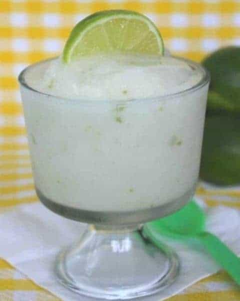 A glass container of lime sorbet.